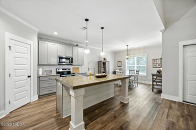 Beautifully maintained and move-in ready, this 5 bedroom, 4 bath on Canongate At Healy Point Country Club in Georgia - for sale on GolfHomes.com, golf home, golf lot