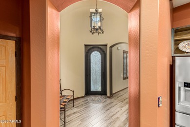 Charming Spanish-style single-level pool home in the heart of on Verrado Golf Club  in Arizona - for sale on GolfHomes.com, golf home, golf lot