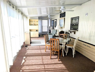This adorable mobile home is ready for its next owner! The home on River Run Golf Links in Florida - for sale on GolfHomes.com, golf home, golf lot