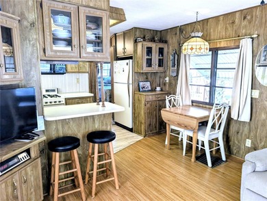 This adorable mobile home is ready for its next owner! The home on River Run Golf Links in Florida - for sale on GolfHomes.com, golf home, golf lot