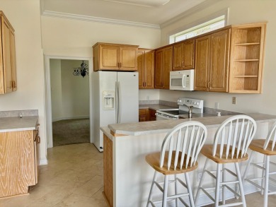 Welcome to this charming lakefront home in the private gated on Emerald Bay Golf Club in Florida - for sale on GolfHomes.com, golf home, golf lot