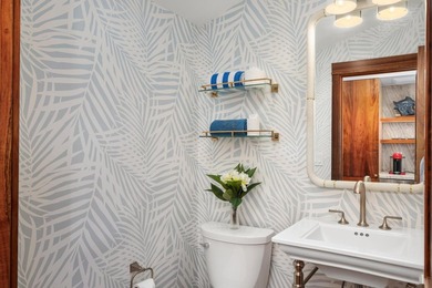 Enjoy sweeping ocean and sunset views from this beautifully on Kona Country Club Golf Course in Hawaii - for sale on GolfHomes.com, golf home, golf lot