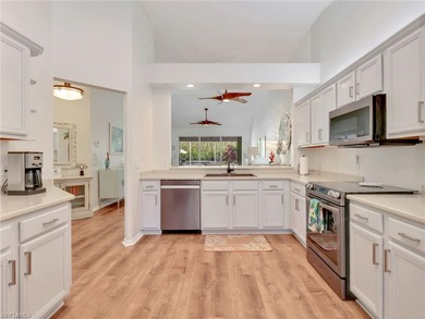 Beautifully updated and meticulously maintained, this 3-bedroom on The Colony Golf and Country Club in Florida - for sale on GolfHomes.com, golf home, golf lot