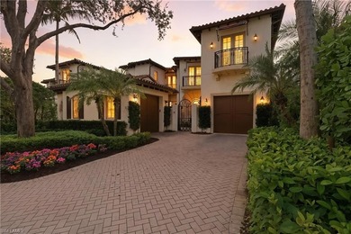 Stunning lake and golf course views surround this elegant on Bears Paw Country Club in Florida - for sale on GolfHomes.com, golf home, golf lot