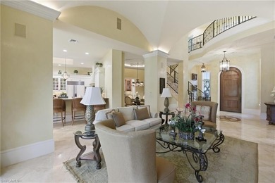 Stunning lake and golf course views surround this elegant on Bears Paw Country Club in Florida - for sale on GolfHomes.com, golf home, golf lot