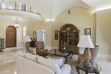 Stunning lake and golf course views surround this elegant on Bears Paw Country Club in Florida - for sale on GolfHomes.com, golf home, golf lot