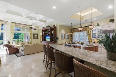 Stunning lake and golf course views surround this elegant on Bears Paw Country Club in Florida - for sale on GolfHomes.com, golf home, golf lot