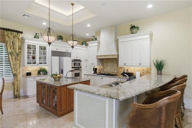 Stunning lake and golf course views surround this elegant on Bears Paw Country Club in Florida - for sale on GolfHomes.com, golf home, golf lot