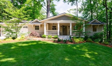 Stunning home with a rocking chair front porch on a friendly on Bobby Jones Golf Club in Georgia - for sale on GolfHomes.com, golf home, golf lot