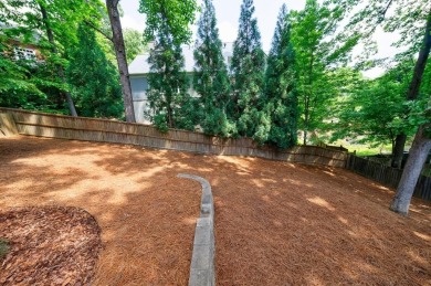 Stunning home with a rocking chair front porch on a friendly on Bobby Jones Golf Club in Georgia - for sale on GolfHomes.com, golf home, golf lot