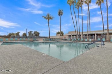 Don't judge this home by the front door. Inside, it's calm on Sun Lakes Country Club in Arizona - for sale on GolfHomes.com, golf home, golf lot