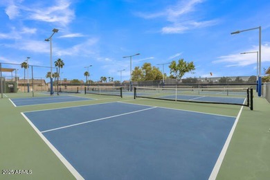 Don't judge this home by the front door. Inside, it's calm on Sun Lakes Country Club in Arizona - for sale on GolfHomes.com, golf home, golf lot