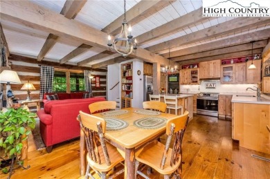 Welcome to your dream retreat. This charming log cabin is on Mountain Aire Golf Course in North Carolina - for sale on GolfHomes.com, golf home, golf lot