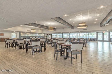 Don't judge this home by the front door. Inside, it's calm on Sun Lakes Country Club in Arizona - for sale on GolfHomes.com, golf home, golf lot