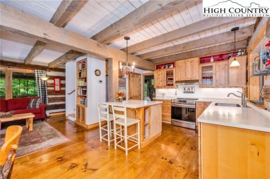 Welcome to your dream retreat. This charming log cabin is on Mountain Aire Golf Course in North Carolina - for sale on GolfHomes.com, golf home, golf lot