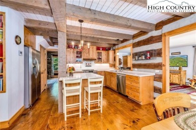 Welcome to your dream retreat. This charming log cabin is on Mountain Aire Golf Course in North Carolina - for sale on GolfHomes.com, golf home, golf lot