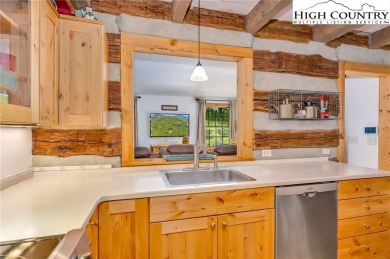 Welcome to your dream retreat. This charming log cabin is on Mountain Aire Golf Course in North Carolina - for sale on GolfHomes.com, golf home, golf lot