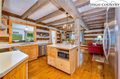 Welcome to your dream retreat. This charming log cabin is on Mountain Aire Golf Course in North Carolina - for sale on GolfHomes.com, golf home, golf lot