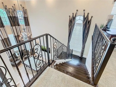 Discover a stunning transitional home with an *Active Reunion on ChampionsGate Golf Resort in Florida - for sale on GolfHomes.com, golf home, golf lot