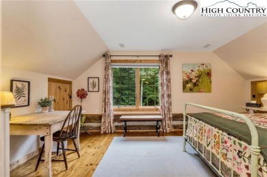 Welcome to your dream retreat. This charming log cabin is on Mountain Aire Golf Course in North Carolina - for sale on GolfHomes.com, golf home, golf lot