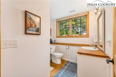 Welcome to your dream retreat. This charming log cabin is on Mountain Aire Golf Course in North Carolina - for sale on GolfHomes.com, golf home, golf lot