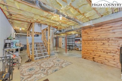 Welcome to your dream retreat. This charming log cabin is on Mountain Aire Golf Course in North Carolina - for sale on GolfHomes.com, golf home, golf lot