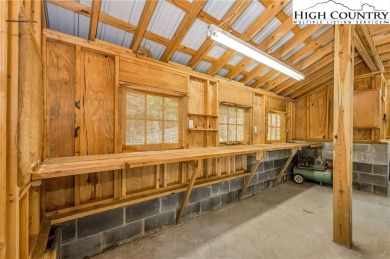 Welcome to your dream retreat. This charming log cabin is on Mountain Aire Golf Course in North Carolina - for sale on GolfHomes.com, golf home, golf lot