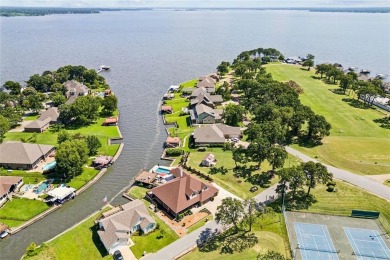Experience the pinnacle of lakeside luxury with this exquisitely on Cedar Creek Country Club in Texas - for sale on GolfHomes.com, golf home, golf lot