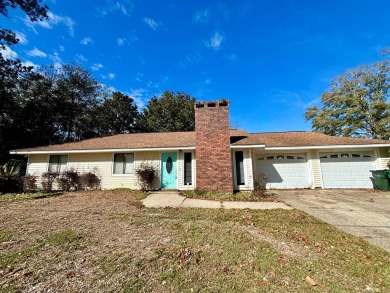 This 3 bedroom home is located in Diamondhead. Wood burning on Diamondhead Country Club in Mississippi - for sale on GolfHomes.com, golf home, golf lot