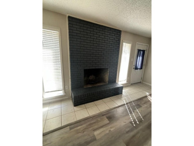 This 3 bedroom home is located in Diamondhead. Wood burning on Diamondhead Country Club in Mississippi - for sale on GolfHomes.com, golf home, golf lot