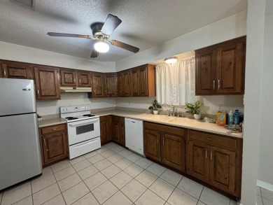 This 3 bedroom home is located in Diamondhead. Wood burning on Diamondhead Country Club in Mississippi - for sale on GolfHomes.com, golf home, golf lot