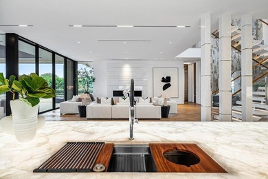 Step into unparalleled luxury in this brand-new custom estate on Jonathans Landing Golf Club in Florida - for sale on GolfHomes.com, golf home, golf lot