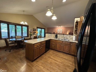 Nestled in a quiet, wooded neighborhood between Sunnyside Park & on Burlington Golf Club in Iowa - for sale on GolfHomes.com, golf home, golf lot