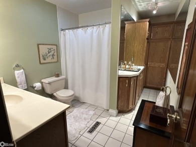 Nestled in a quiet, wooded neighborhood between Sunnyside Park & on Burlington Golf Club in Iowa - for sale on GolfHomes.com, golf home, golf lot