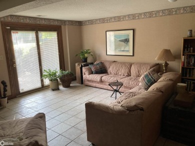 Nestled in a quiet, wooded neighborhood between Sunnyside Park & on Burlington Golf Club in Iowa - for sale on GolfHomes.com, golf home, golf lot