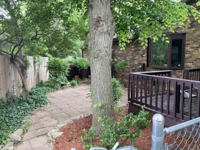 Nestled in a quiet, wooded neighborhood between Sunnyside Park & on Burlington Golf Club in Iowa - for sale on GolfHomes.com, golf home, golf lot