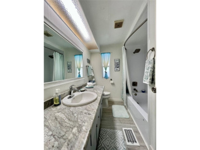 This beautifully updated 2-bedroom, 2-bathroom home is located on Fairway Village Golf Course in Florida - for sale on GolfHomes.com, golf home, golf lot