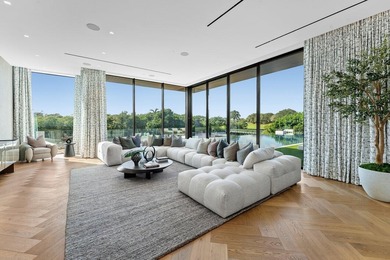 Step into unparalleled luxury in this brand-new custom estate on Jonathans Landing Golf Club in Florida - for sale on GolfHomes.com, golf home, golf lot