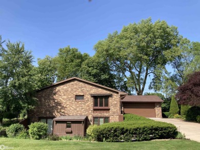 Nestled in a quiet, wooded neighborhood between Sunnyside Park & on Burlington Golf Club in Iowa - for sale on GolfHomes.com, golf home, golf lot