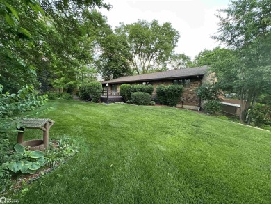 Nestled in a quiet, wooded neighborhood between Sunnyside Park & on Burlington Golf Club in Iowa - for sale on GolfHomes.com, golf home, golf lot