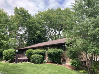 Nestled in a quiet, wooded neighborhood between Sunnyside Park & on Burlington Golf Club in Iowa - for sale on GolfHomes.com, golf home, golf lot