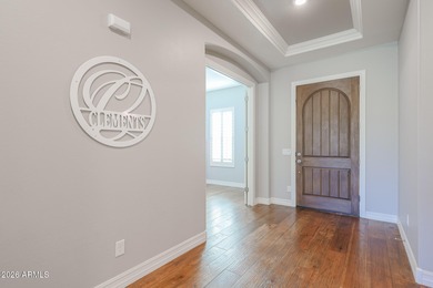 This exceptional energy-efficient 4-bedroom, 3.5-bath home with on Estrella Mountain Ranch Golf Course in Arizona - for sale on GolfHomes.com, golf home, golf lot