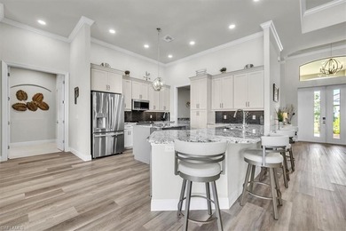 Discover the epitome of luxurious, low maintenance living in on River Hall Country Club in Florida - for sale on GolfHomes.com, golf home, golf lot