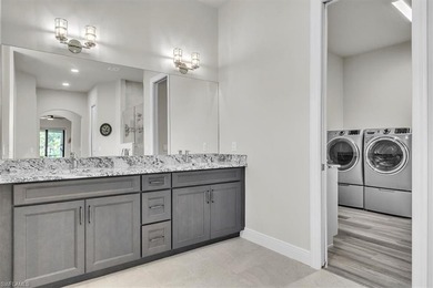 Discover the epitome of luxurious, low maintenance living in on River Hall Country Club in Florida - for sale on GolfHomes.com, golf home, golf lot