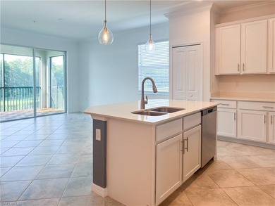 This spacious top floor, end unit, 3-bedroom, move-in ready on Panther Run Golf Club in Florida - for sale on GolfHomes.com, golf home, golf lot