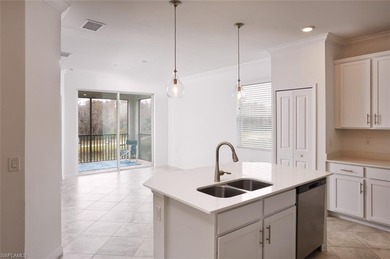 This spacious top floor, end unit, 3-bedroom, move-in ready on Panther Run Golf Club in Florida - for sale on GolfHomes.com, golf home, golf lot