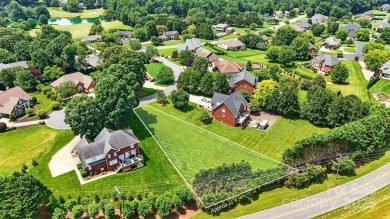 Large and cleared, perfectly sloping lot in Rock Barn Country on Rock Barn Golf and Spa in North Carolina - for sale on GolfHomes.com, golf home, golf lot