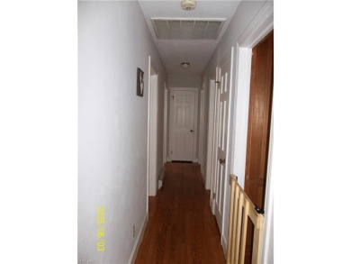 Well maintained brick ranch with a short walk between the hedges on Cypress Cove Country Club in Virginia - for sale on GolfHomes.com, golf home, golf lot