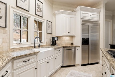 This grand Greystone home is nestled within its wooded  private on Greystone Golf and Country Club-Founders Course in Alabama - for sale on GolfHomes.com, golf home, golf lot
