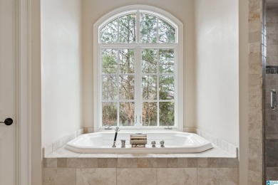 This grand Greystone home is nestled within its wooded  private on Greystone Golf and Country Club-Founders Course in Alabama - for sale on GolfHomes.com, golf home, golf lot